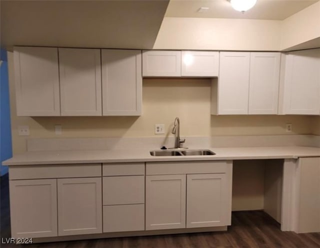 kitchen with sink, dark wood-type flooring, and white cabinets