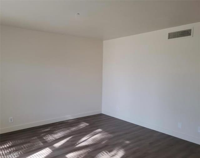 unfurnished room featuring wood-type flooring