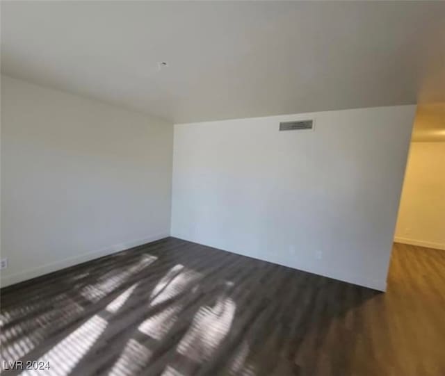 spare room featuring hardwood / wood-style floors