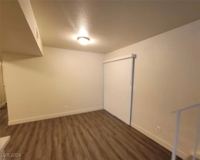 basement featuring wood-type flooring