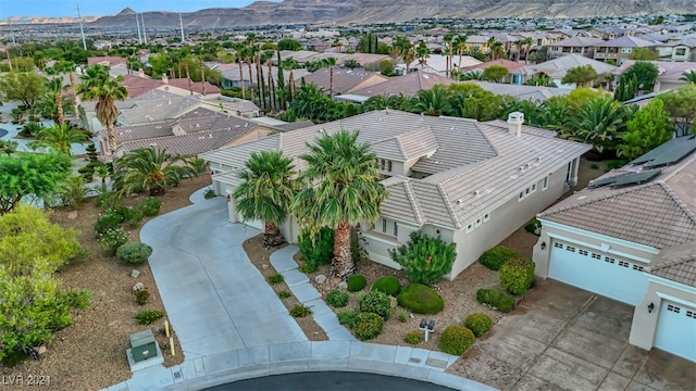 birds eye view of property with a mountain view