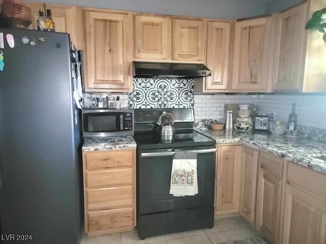 kitchen featuring decorative backsplash, light stone countertops, black appliances, light tile patterned floors, and light brown cabinets