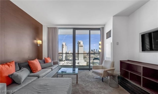 carpeted living room featuring a wall of windows