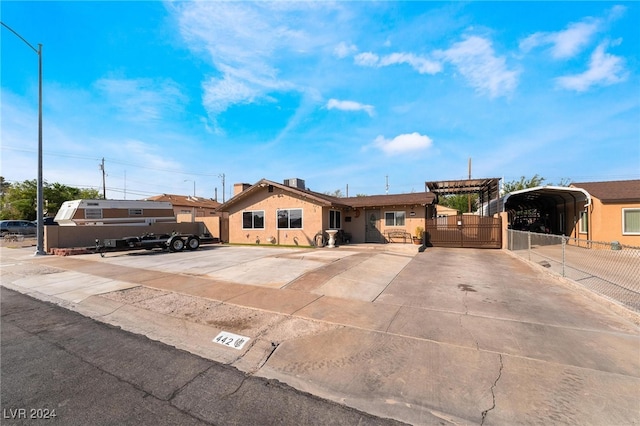 ranch-style home featuring a carport