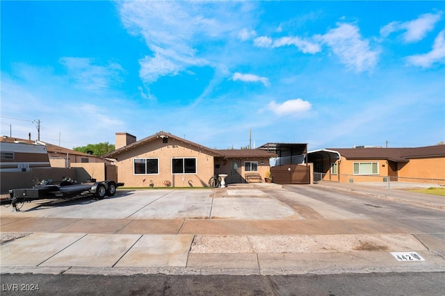 ranch-style house with a carport