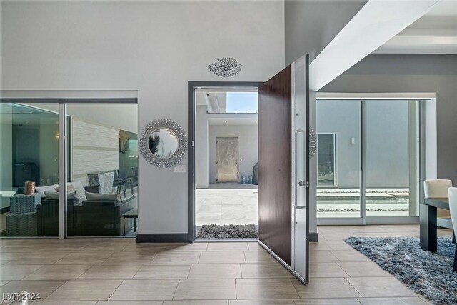 entryway featuring light tile patterned floors