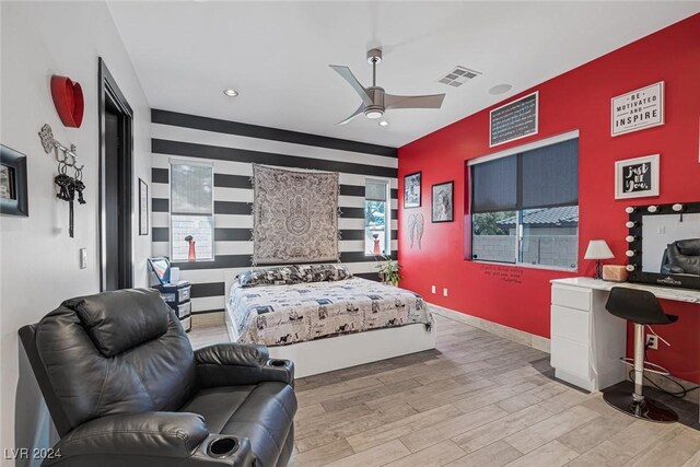 bedroom featuring light wood-type flooring and ceiling fan