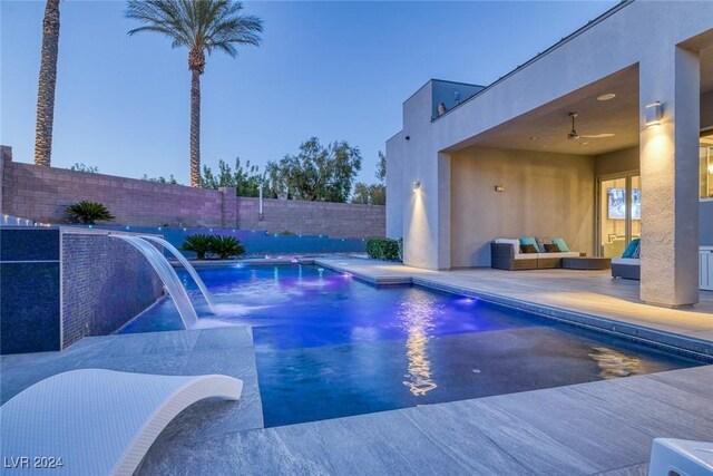 view of swimming pool with a patio, pool water feature, and outdoor lounge area