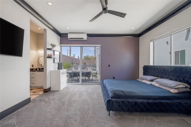 bedroom featuring connected bathroom, access to exterior, ceiling fan, light colored carpet, and a wall unit AC