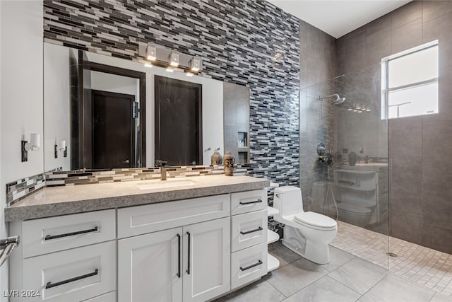 bathroom featuring toilet, an enclosed shower, tile patterned flooring, vanity, and tile walls