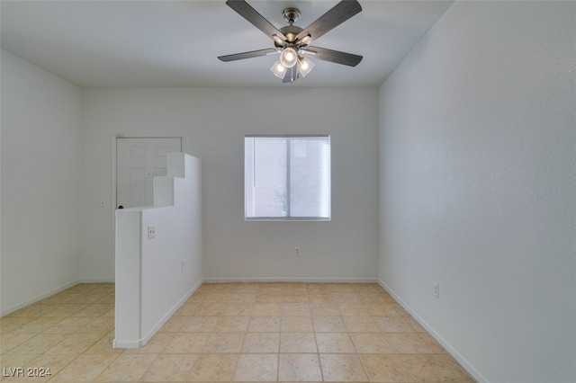 spare room featuring ceiling fan