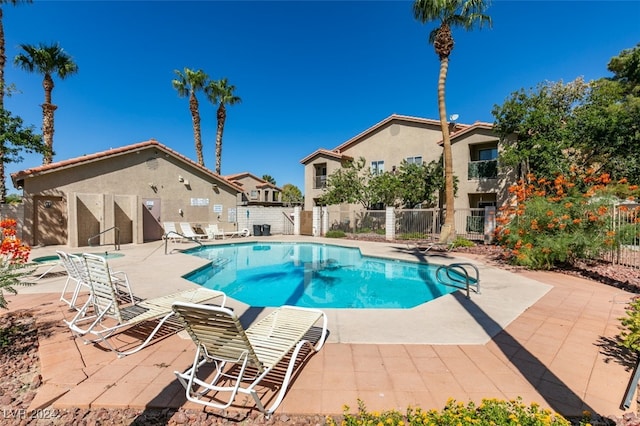 view of swimming pool with a patio