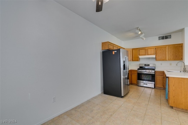 kitchen with ceiling fan, stainless steel appliances, sink, and rail lighting