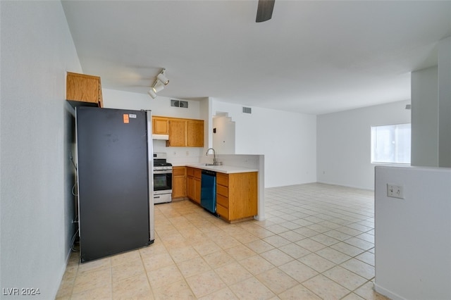 kitchen featuring dishwasher, sink, stainless steel stove, fridge, and ceiling fan