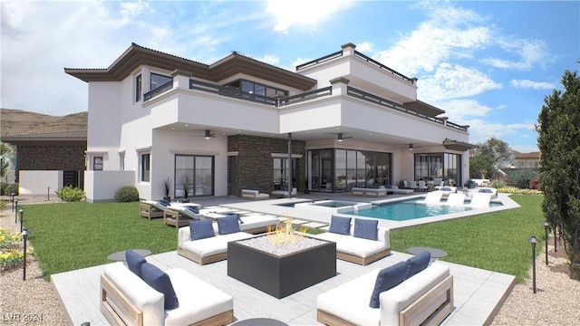 rear view of house featuring an outdoor living space with a fire pit, a balcony, ceiling fan, a patio area, and stucco siding