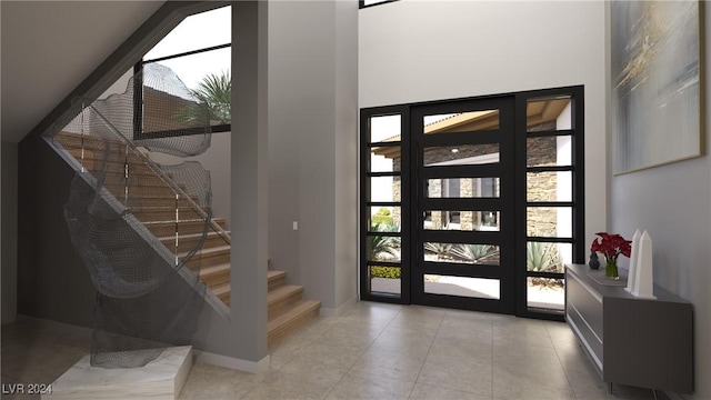 foyer entrance featuring tile patterned flooring and stairs