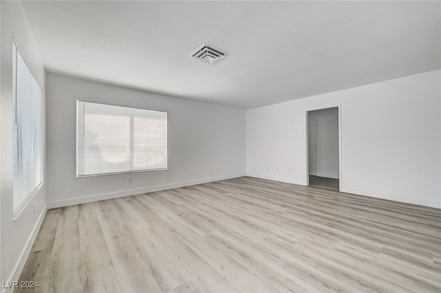 empty room with light hardwood / wood-style floors