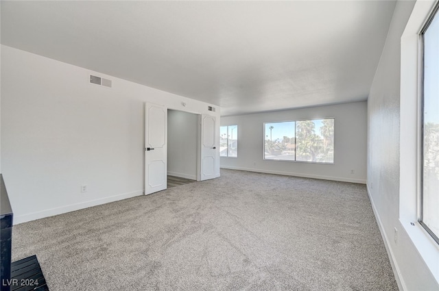 interior space featuring light colored carpet