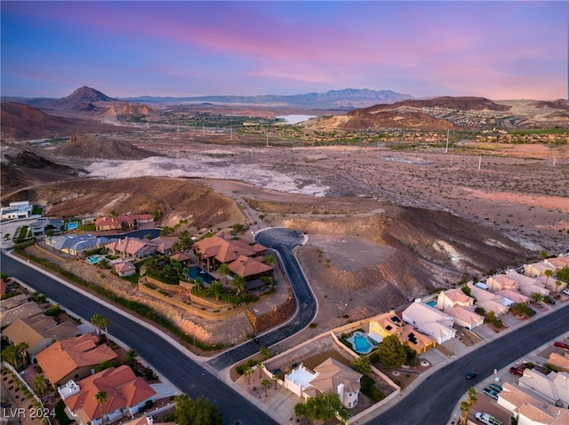 aerial view at dusk with a mountain view