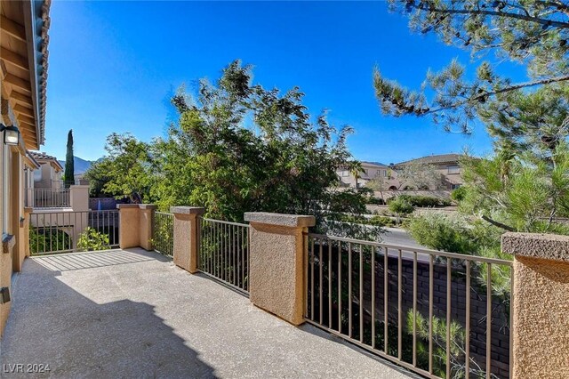 view of patio featuring a balcony