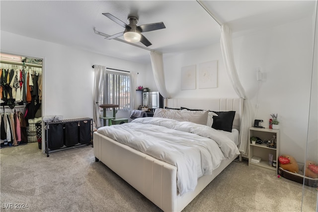 carpeted bedroom with ceiling fan and a closet