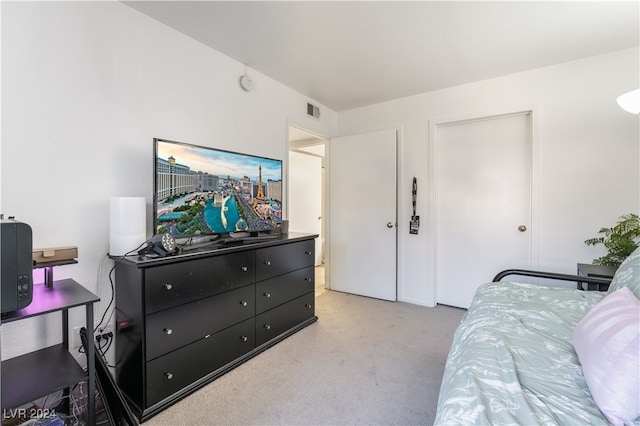 bedroom featuring light carpet