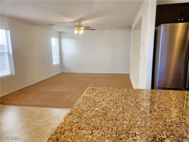 interior space with visible vents and a ceiling fan