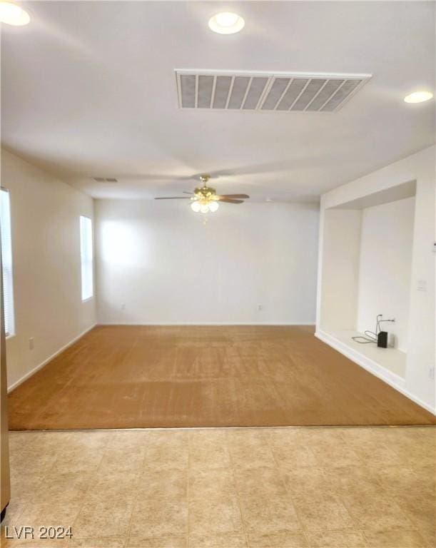 spare room featuring ceiling fan, visible vents, and recessed lighting