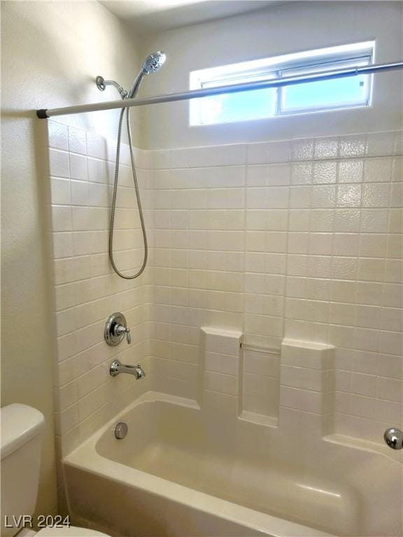 full bathroom featuring bathtub / shower combination and toilet