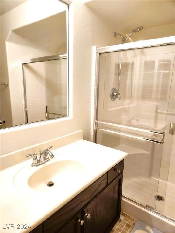 full bath featuring a shower stall and vanity