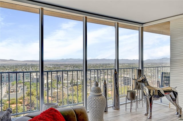 sunroom featuring a mountain view