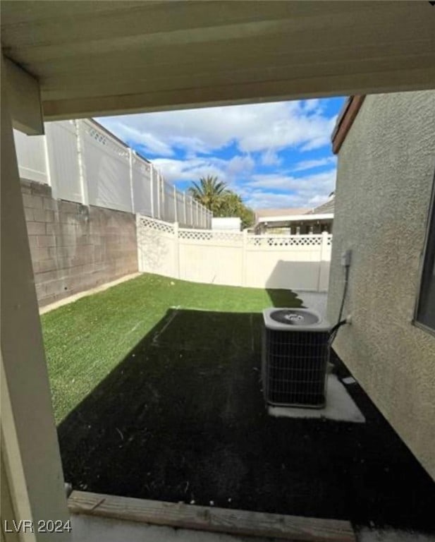 view of yard with central AC unit