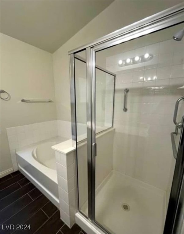 bathroom with tile patterned floors and separate shower and tub