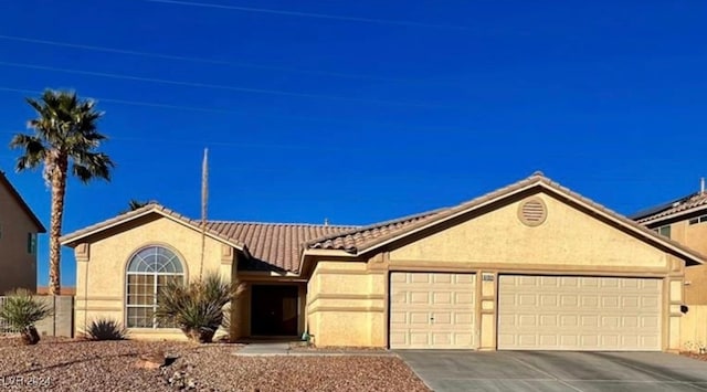 ranch-style home featuring a garage