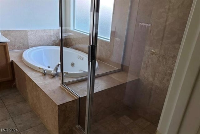 bathroom with tile patterned floors, separate shower and tub, and vanity