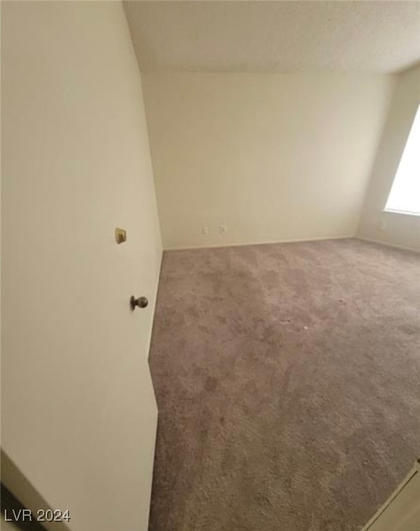 empty room featuring carpet flooring