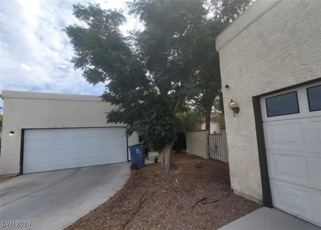 view of side of property featuring a garage