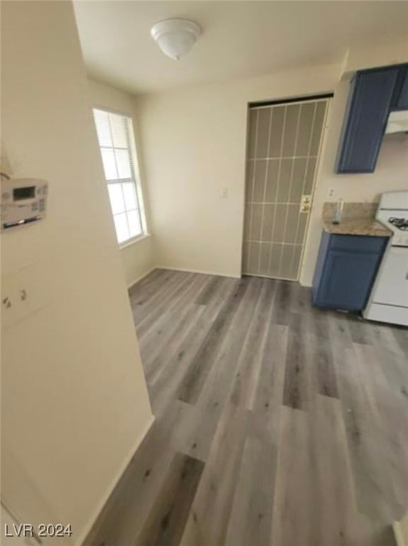 unfurnished dining area with hardwood / wood-style flooring