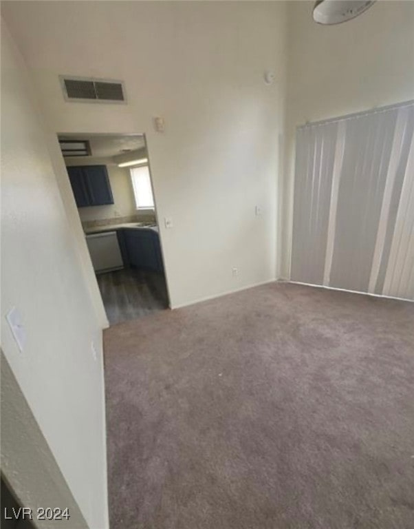 unfurnished living room featuring carpet