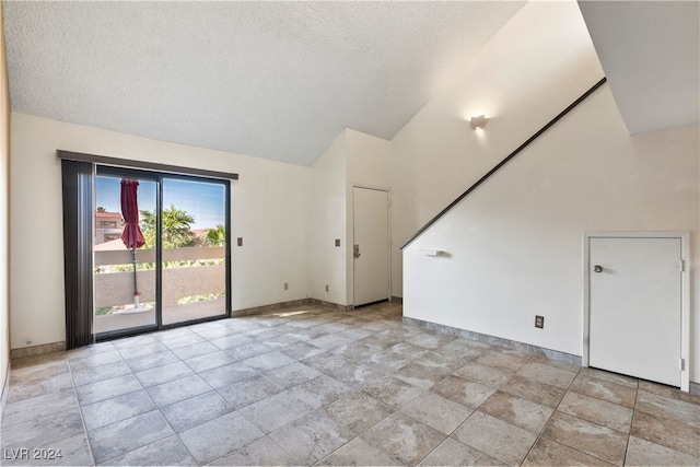 bonus room featuring a towering ceiling