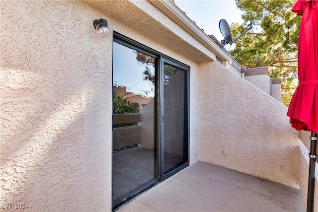 doorway to property featuring a patio