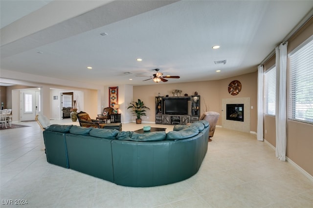 tiled living room featuring ceiling fan