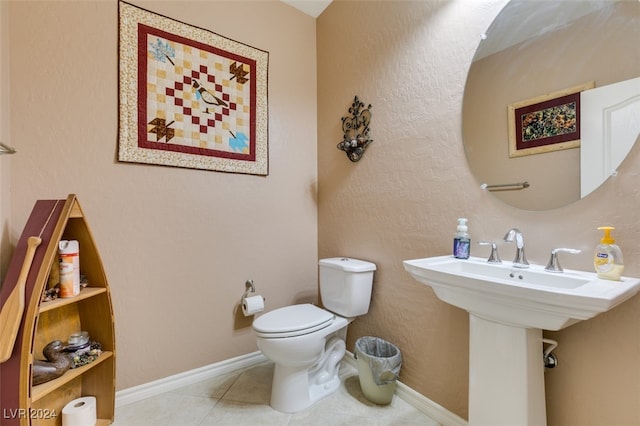 bathroom with tile patterned floors and toilet