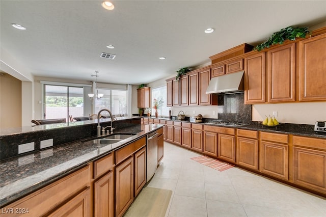 kitchen with sink, dark stone countertops, appliances with stainless steel finishes, ventilation hood, and light tile patterned floors