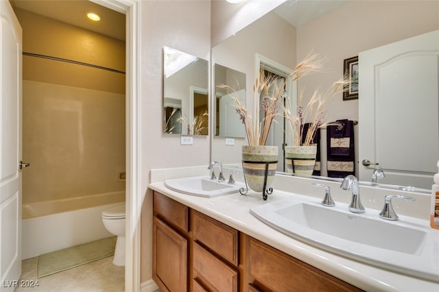 full bathroom featuring tile patterned flooring, toilet, shower / bathing tub combination, and vanity