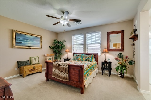 bedroom featuring ceiling fan and light colored carpet