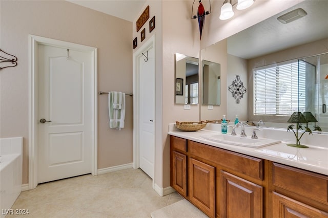 bathroom featuring a washtub, tile patterned flooring, and vanity