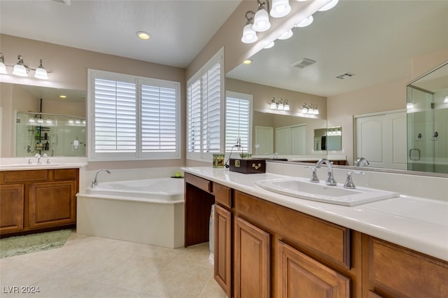 bathroom featuring plus walk in shower, tile patterned floors, and vanity