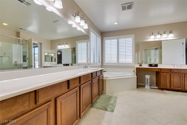 bathroom featuring tile patterned flooring, separate shower and tub, and vanity