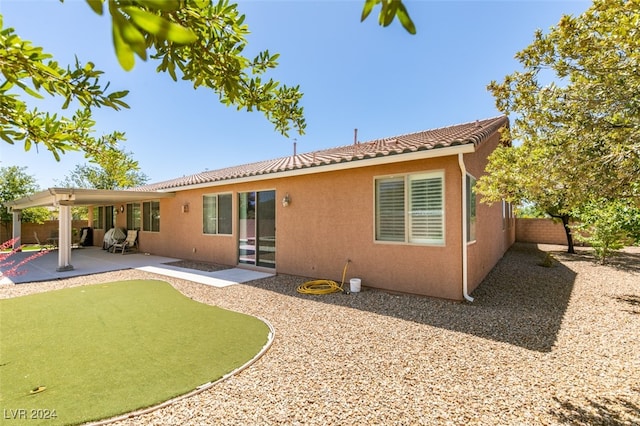 rear view of house with a patio